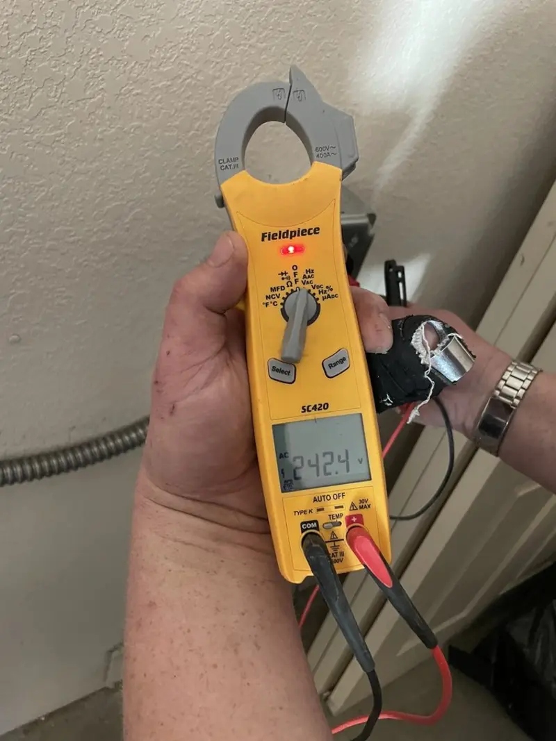 Voltage testing with clamp meter during Recessed Lighting Installation in Whiteriver